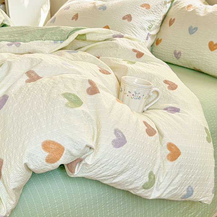 91家纺网 家纺一手货源 找家纺 桔禾家纺 2026春夏新款小清新A类超柔泡芙棉泡泡纱双层纱四件套 马卡龙爱心