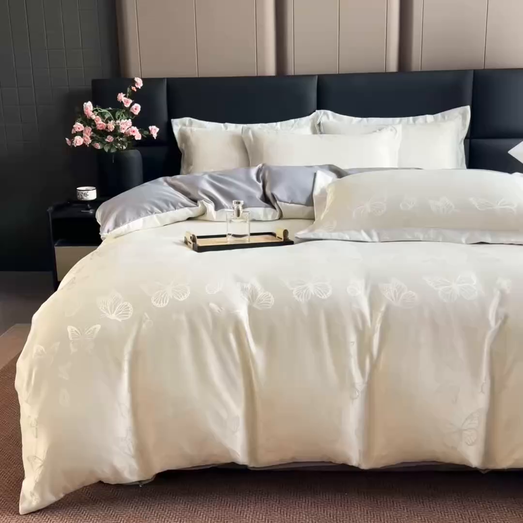 91家纺网 家纺一手货源 找家纺 畅畅家纺 2026春夏新款高档轻奢水洗真丝提花四件套夏天纯色床单床笠 蝶之恋-白拼灰