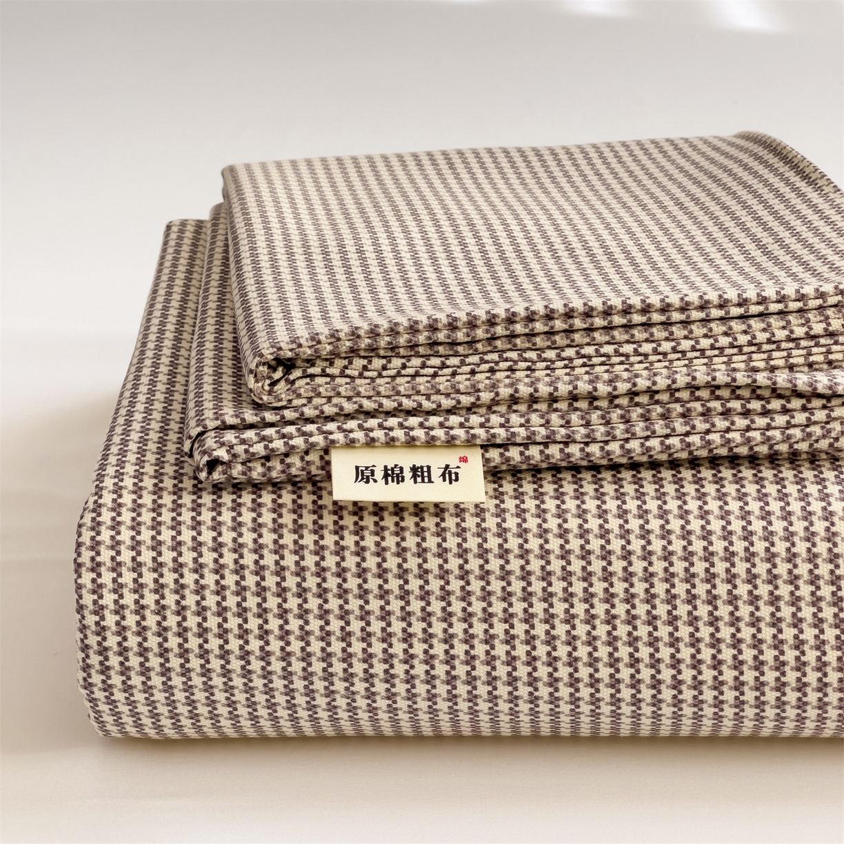 91家纺网 家纺一手货源 找家纺 名兮家居 2026新款全棉A类卡通简约时尚老粗布床单 千鸟格