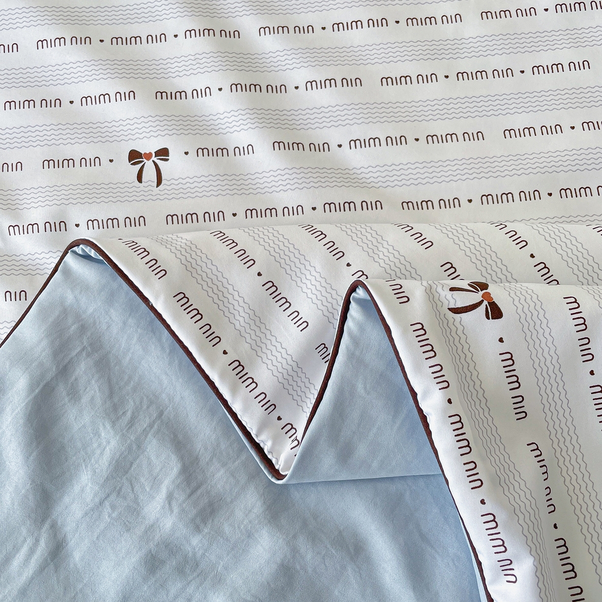 91家纺网 家纺一手货源 找家纺 宜梦家居 2026新款A类凉感天丝夏被夏凉被空调被 奶白蝴蝶结