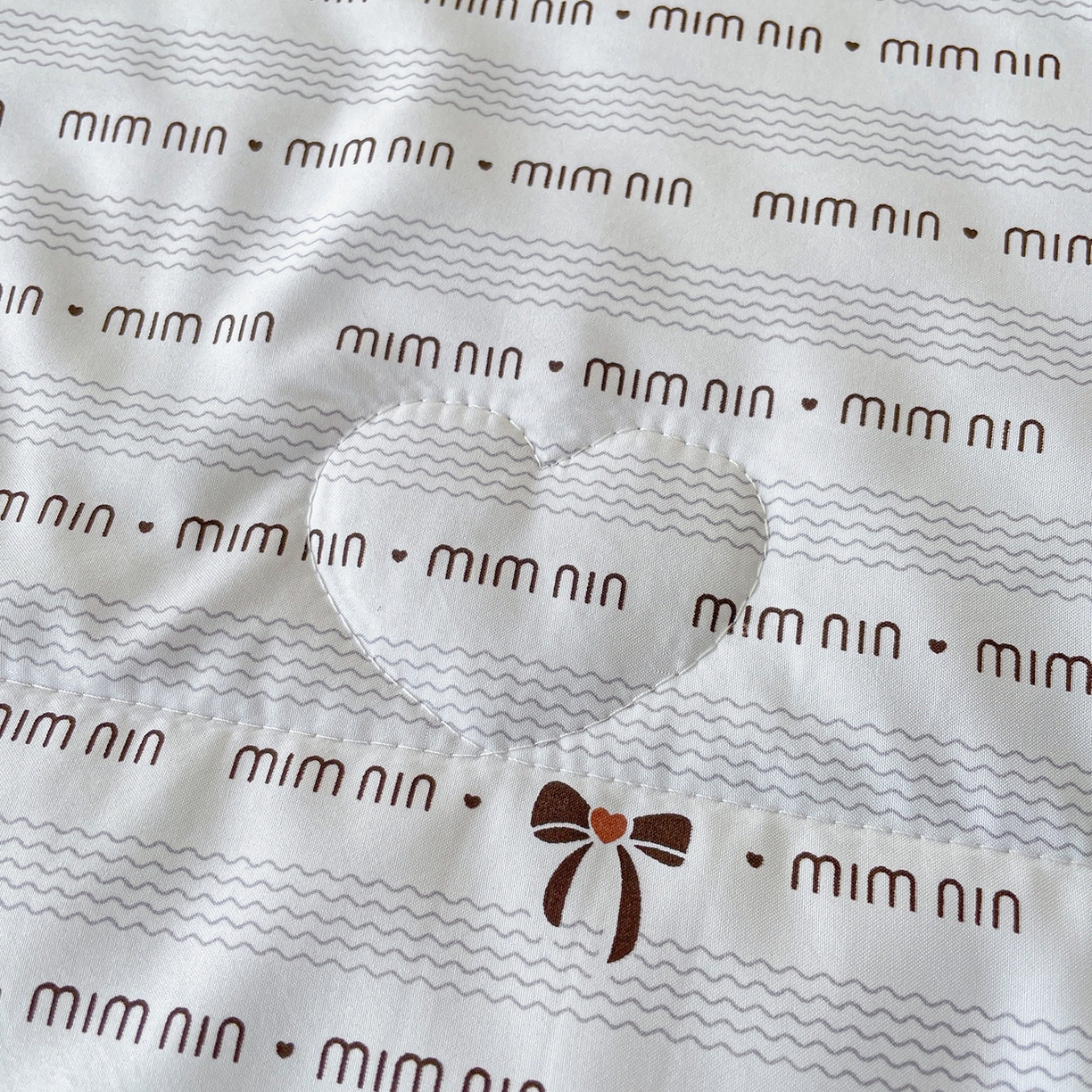 91家纺网 家纺一手货源 找家纺 宜梦家居 2026新款A类凉感天丝夏被夏凉被空调被 奶白蝴蝶结