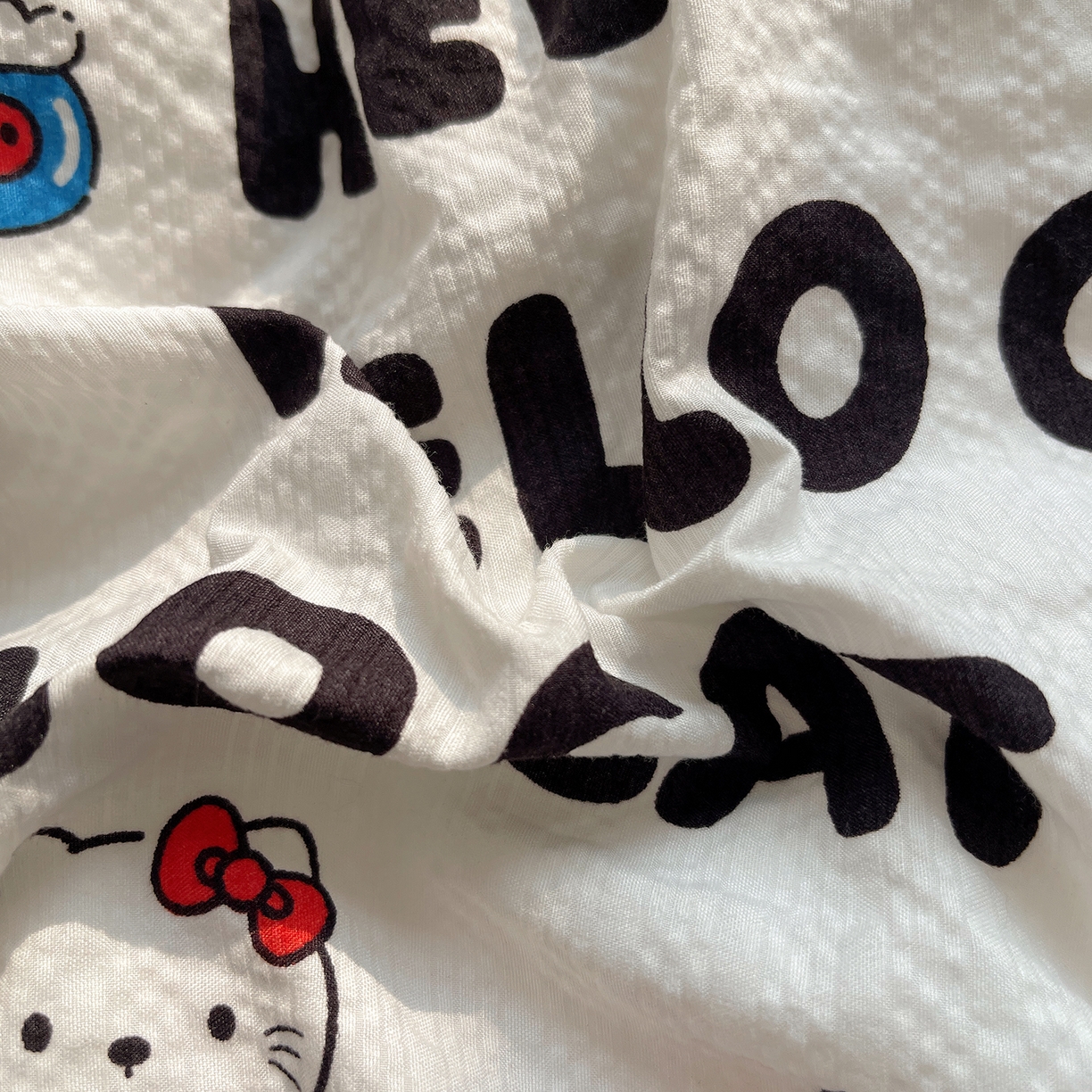 91家纺网 家纺一手货源 找家纺 桃心家居 2026新款A类费尔岛可爱卡通贝壳边三角针工艺双层纱泡芙棉泡芙纱系列四件套 泡芙棉-奶油猫