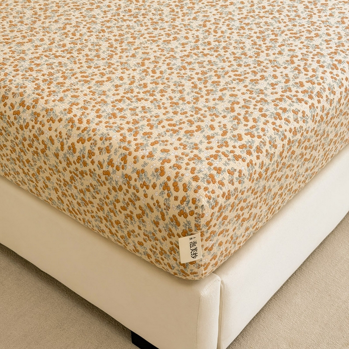 91家纺网 家纺一手货源 找家纺 几禾 2026新款高克重泡芙纱~印花款（单床笠）浅糯系列-110g CL浅糯-暖橘枝