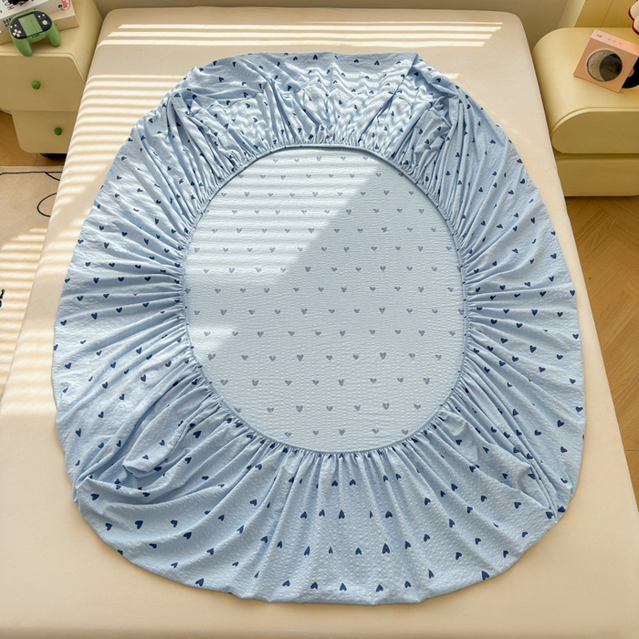 91家纺网 家纺一手货源 找家纺 梵朴 2026新款A类泡芙棉云感木棉邹邹纱双层纱床笠三件套 蓝调爱心