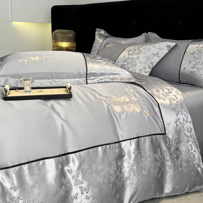 91家纺网 家纺一手货源 找家纺 金牛座家纺 2026新款金牛座细斜纹贡缎亮丝提花大拼角刺绣床盖四件套-缇娜系列 缇娜-灰