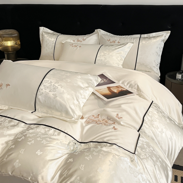 91家纺网 家纺一手货源 找家纺 金牛座家纺 2026新款金牛座细斜纹贡缎亮丝提花大拼角刺绣床盖四件套-缇娜系列 缇娜-奶白
