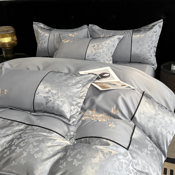 91家纺网 家纺一手货源 找家纺 金牛座家纺 2026新款金牛座细斜纹贡缎亮丝提花大拼角刺绣床盖四件套-缇娜系列 缇娜-灰