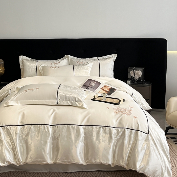 91家纺网 家纺一手货源 找家纺 金牛座家纺 2026新款金牛座细斜纹贡缎亮丝提花大拼角刺绣床盖四件套-缇娜系列 缇娜-奶白