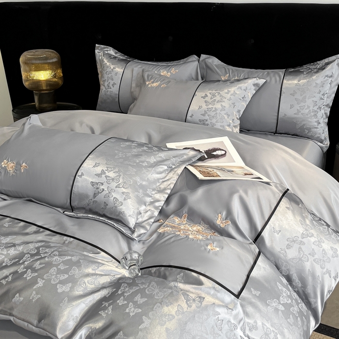 91家纺网 家纺一手货源 找家纺 金牛座家纺 2026新款金牛座细斜纹贡缎亮丝提花大拼角刺绣床盖四件套-缇娜系列 缇娜-灰