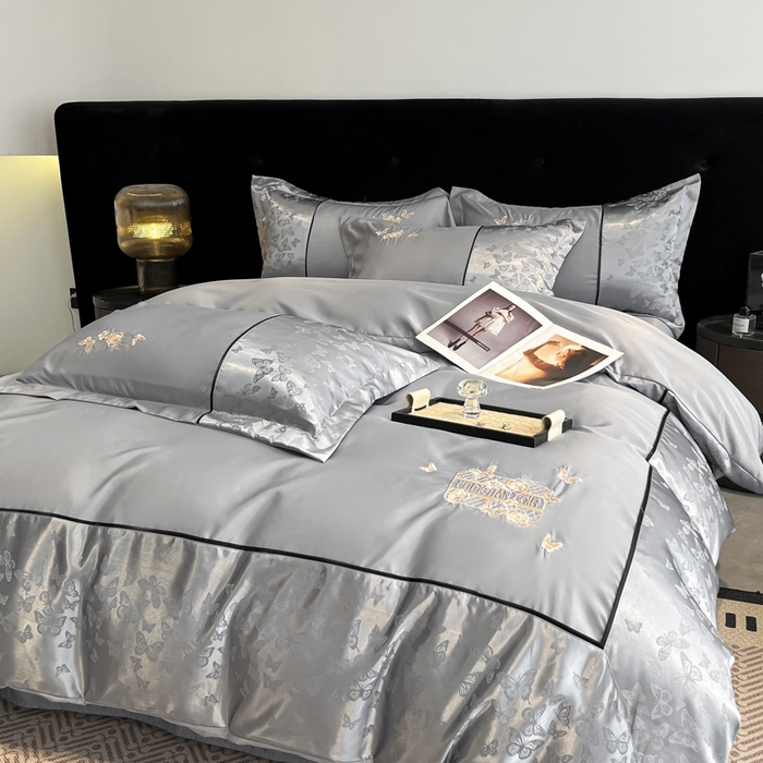 91家纺网 家纺一手货源 找家纺 金牛座家纺 2026新款金牛座细斜纹贡缎亮丝提花大拼角刺绣床盖四件套-缇娜系列 缇娜-灰