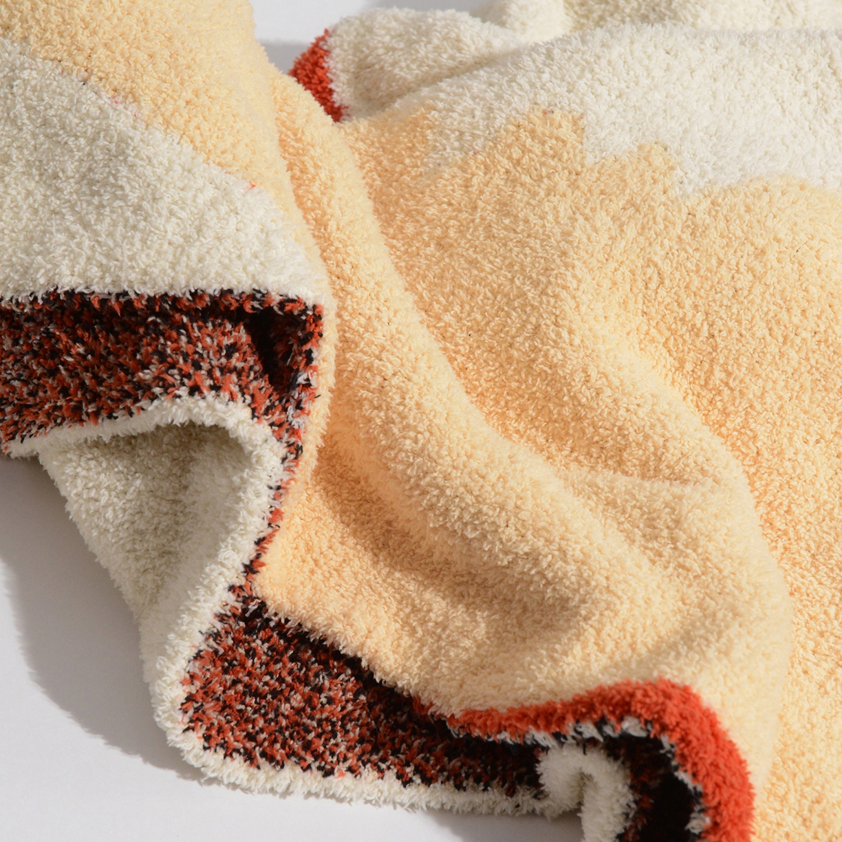 91家纺网 家纺一手货源 找家纺 栩裕纺织 2026新款艺术家居超柔半边绒A类针织毯披肩毯多功能盖毯礼物礼品终端控价 多宝团子针织毯