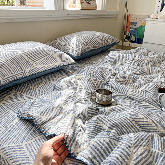 91家纺网 家纺一手货源 找家纺 禾沐 2026新款泡芙纱三角针床盖夏被四件套 浅川纹