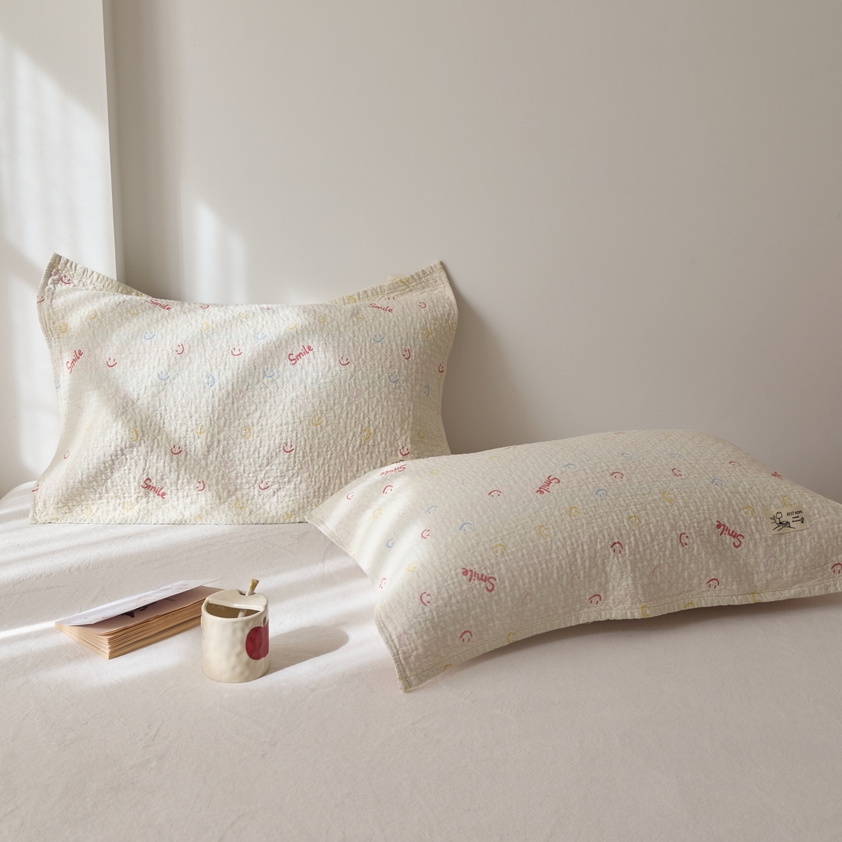 91家纺网 家纺一手货源 找家纺 沐瑟家纺 2026新款安心棉枕巾 笑脸-浅咖