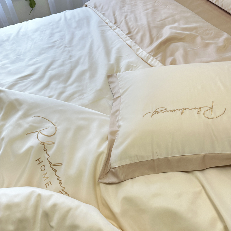 91家纺网 家纺一手货源 找家纺 金麦家纺 2023新款冰丝小拼角四件套系列 小拼角奶昔白