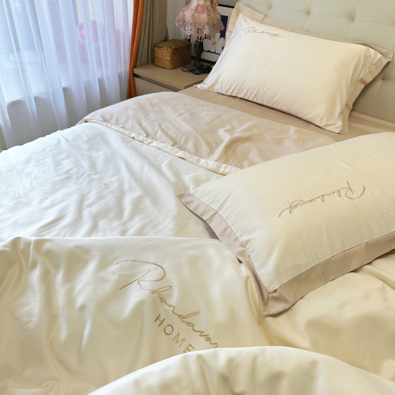 91家纺网 家纺一手货源 找家纺 金麦家纺 2023新款冰丝小拼角四件套系列 小拼角奶昔白