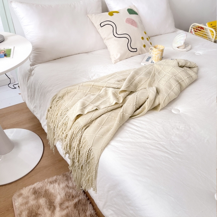 91家纺网 家纺一手货源 找家纺 朴尔针织流苏搭毯搭巾盖毯沙发巾床尾毯床尾旗酒店毯毛毯 米白色