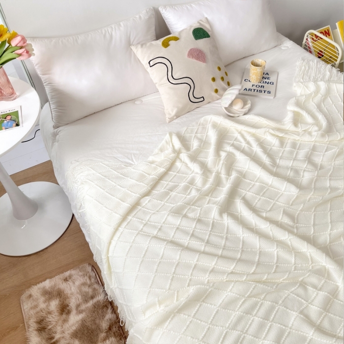 91家纺网 家纺一手货源 找家纺 朴尔针织流苏搭毯搭巾盖毯沙发巾床尾毯床尾旗酒店毯毛毯 乳白色