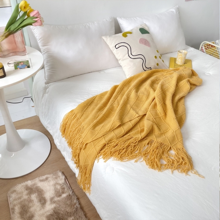 91家纺网 家纺一手货源 找家纺 朴尔针织流苏搭毯搭巾盖毯沙发巾床尾毯床尾旗酒店毯毛毯 杏黄色