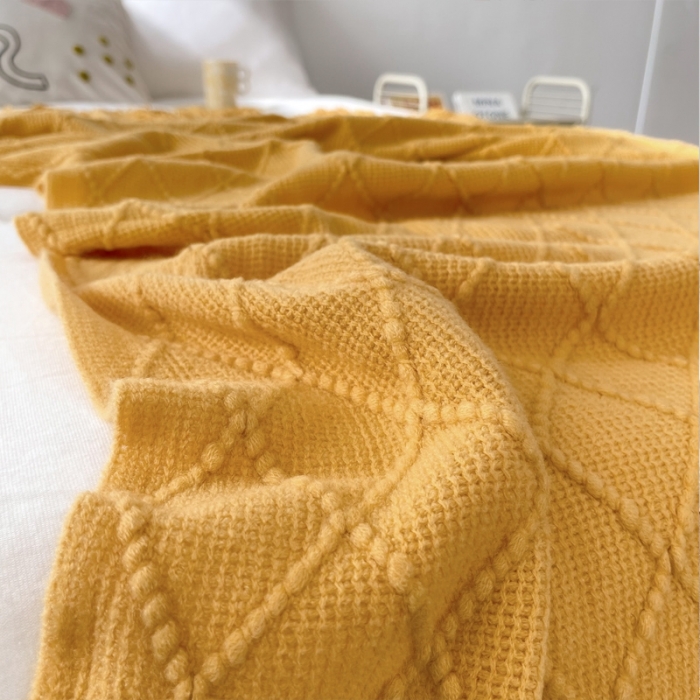 91家纺网 家纺一手货源 找家纺 朴尔针织流苏搭毯搭巾盖毯沙发巾床尾毯床尾旗酒店毯毛毯 杏黄色