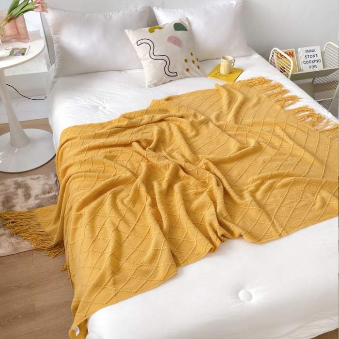 91家纺网 家纺一手货源 找家纺 朴尔针织流苏搭毯搭巾盖毯沙发巾床尾毯床尾旗酒店毯毛毯 杏黄色