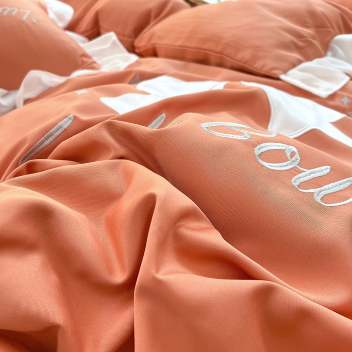 91家纺网 家纺一手货源 找家纺 沐慕 22新款水洗真丝刺绣花边四件套 紫幸运蝴蝶结-桔色