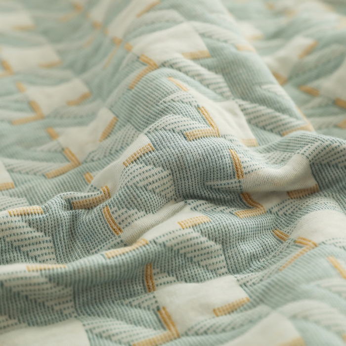 91家纺网 家纺一手货源 找家纺 吾秀家居 2022新款高端全棉针织提花毯 方块千鸟格绿