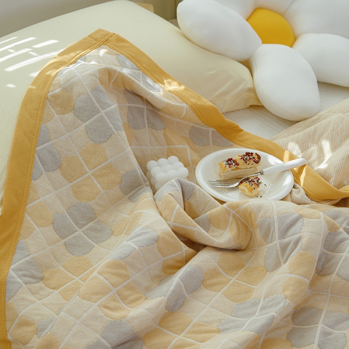 91家纺网 家纺一手货源 找家纺 吾秀家居 2022新款高端全棉针织提花毯四叶草黄