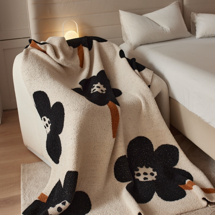 91家纺网 家纺一手货源 找家纺 安莱 设计师太阳花A类半边绒针织毯子沙发办公室午睡毯秋冬 向阳花