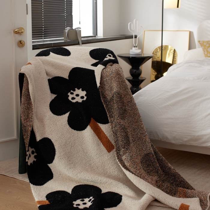 91家纺网 家纺一手货源 找家纺 总 安莱 设计师太阳花A类半边绒针织毯子沙发办公室午睡毯秋冬