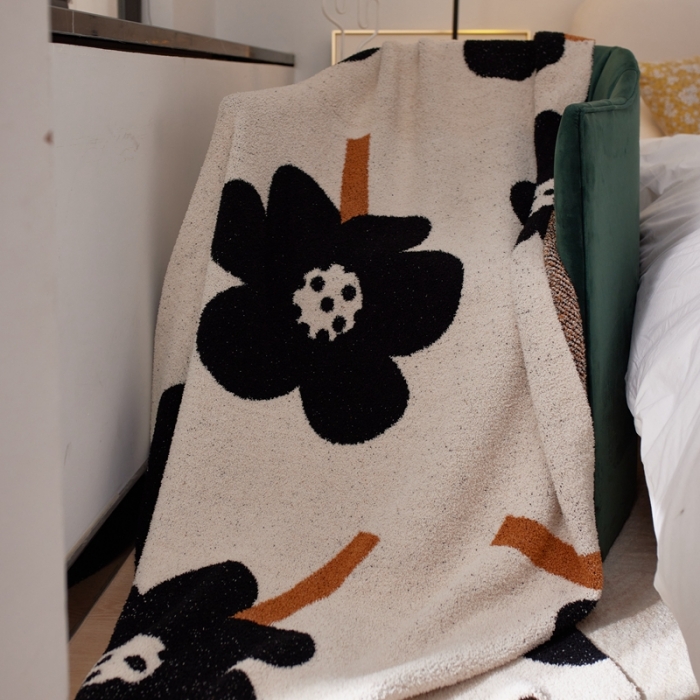91家纺网 家纺一手货源 找家纺 安莱 设计师太阳花A类半边绒针织毯子沙发办公室午睡毯秋冬 向阳花