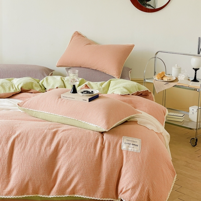 91家纺网 家纺一手货源 找家纺 圆岛 2022新款色织小提花花边款全棉水洗棉四件套 橘粉拼绿