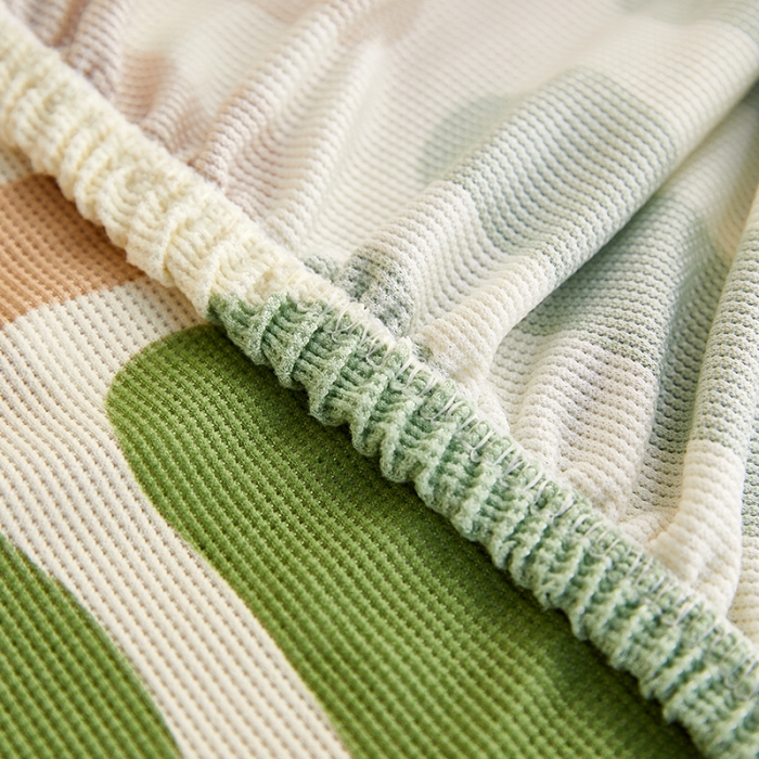 91家纺网 家纺一手货源 找家纺 丝绮鹿2023针织柔肤格贵妃沙发套松紧款 买一个沙发套默认送一个抱枕套 米绿条纹