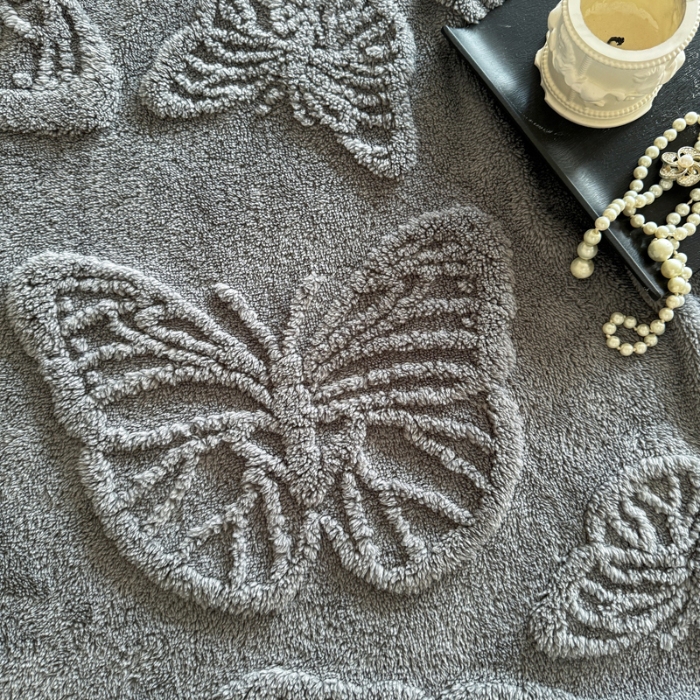 91家纺网 家纺一手货源 找家纺 2025款塔芙绒蝴蝶提花毛毯 纯色多功能休闲盖毯 爆款花型 电商/直播/外贸/跨境专供  蝴蝶蓝灰