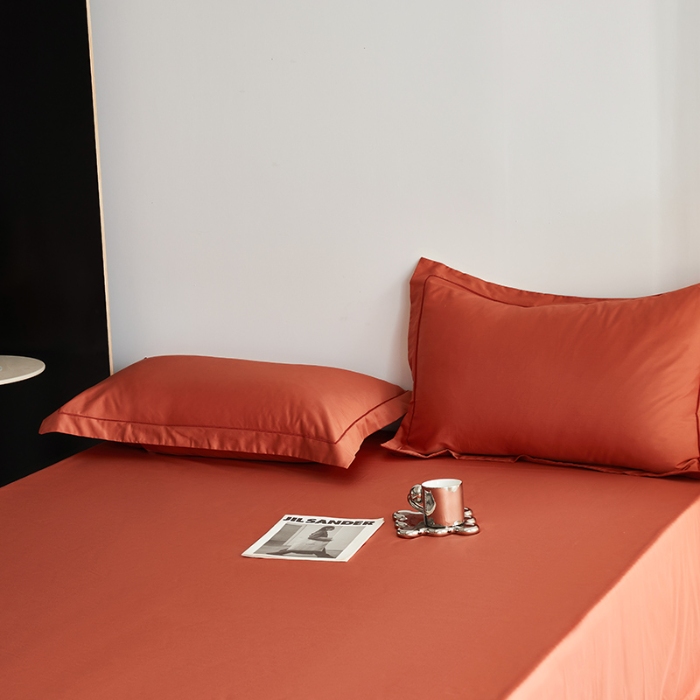 91家纺网 家纺一手货源 找家纺 2025年新款100支纯棉长绒棉全棉贡缎纯色枕套 南瓜红